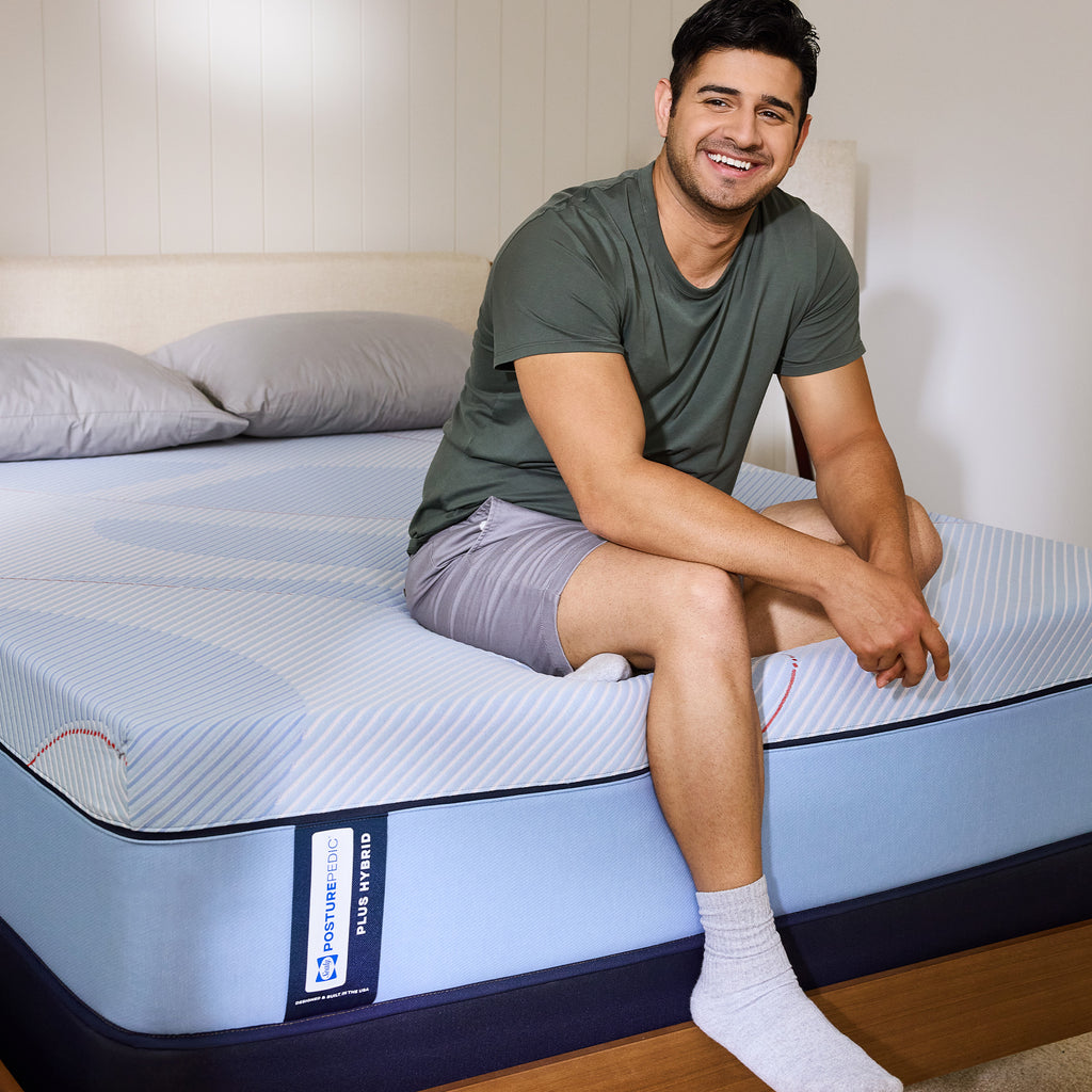 Sealy Posturepedic® Plus Paterson II Hybrid Soft Mattress, Lifestyle with person on bed