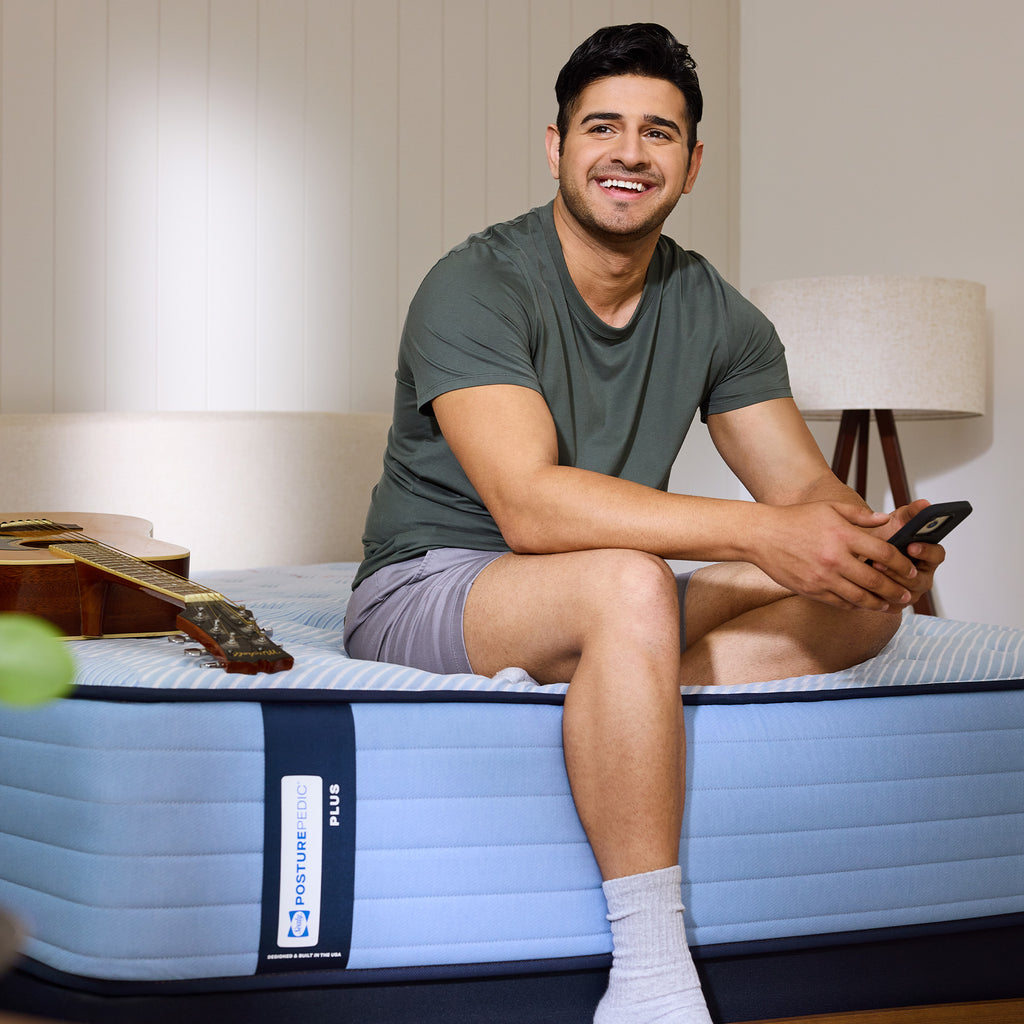 Sealy Posturepedic® Plus Paterson II Medium Mattress, Lifestyle View, Man with Phone