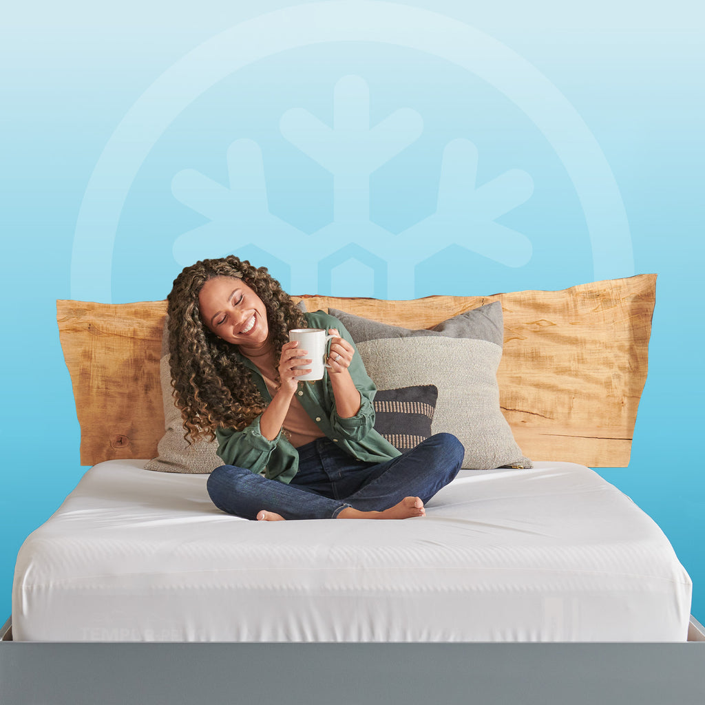 Tempur-Protect® Breeze Mattress Protector, woman on bed