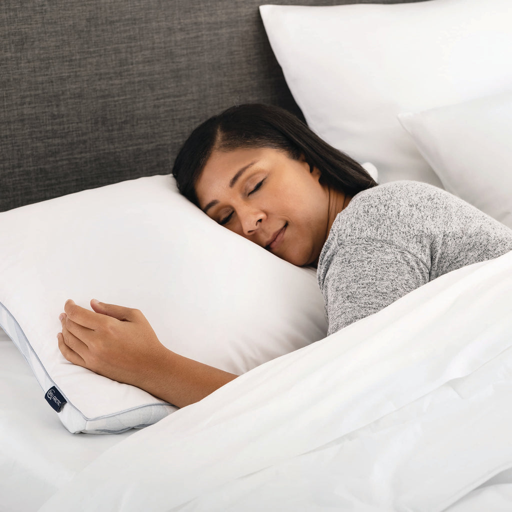 Woman asleep in bed on Serta Arctic Cooling Memory Foam Pillow