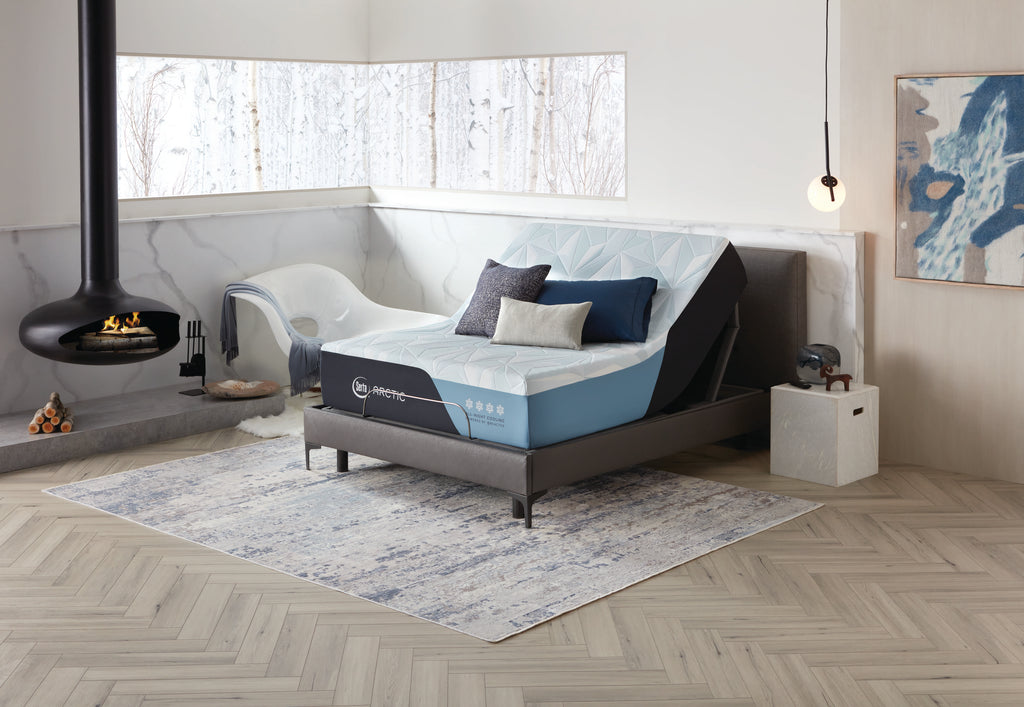 Serta Arctic Premier Firm Mattress on Adjustable Base frame in room with fireplace