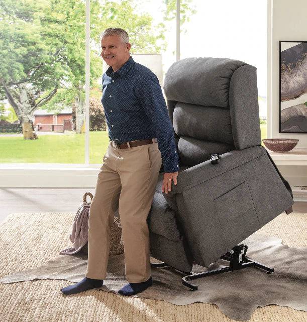 Polaris lift chair recliner, with man standing - Fosters Mattress